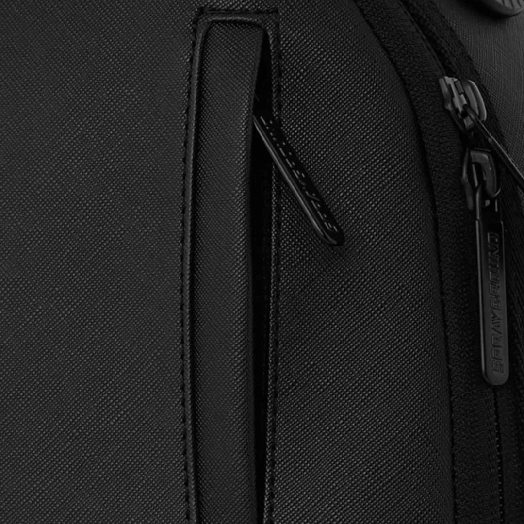 HypeSelection Sprayground Lux Black Ghost Drip Mini DLX backpack featuring a textured black finish and zipper detail