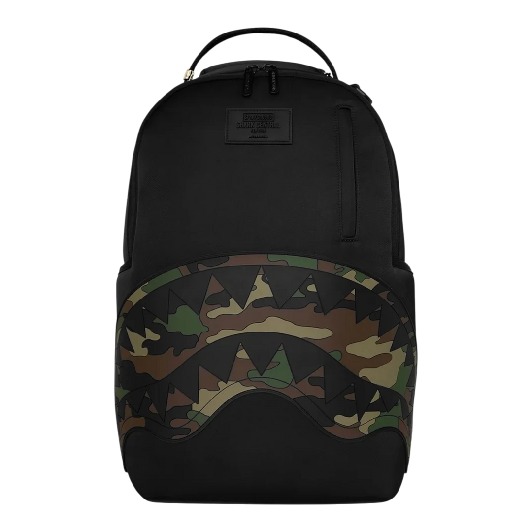 HypeSelection Sprayground black nylon backpack featuring a camo-embossed shark mouth design on the front pocket.