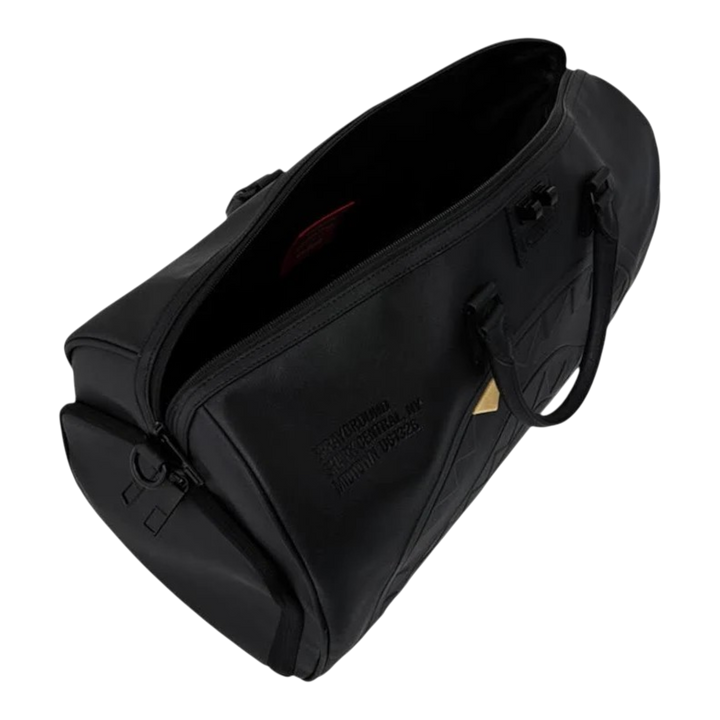 HypeSelection Sprayground black duffle bag with embossed sharkmouth design and gold tooth detail, top view.