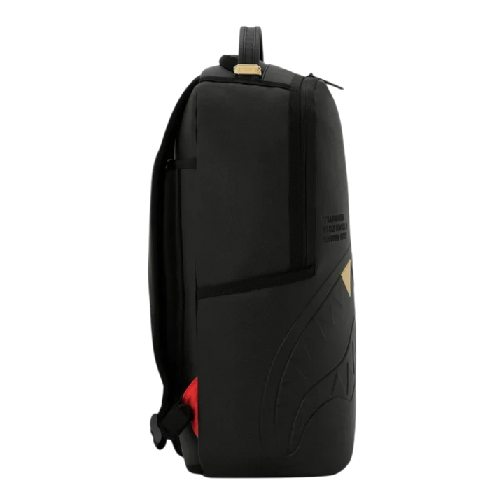 HypeSelection black Sprayground backpack with embossed gold tooth graphic and side view profile