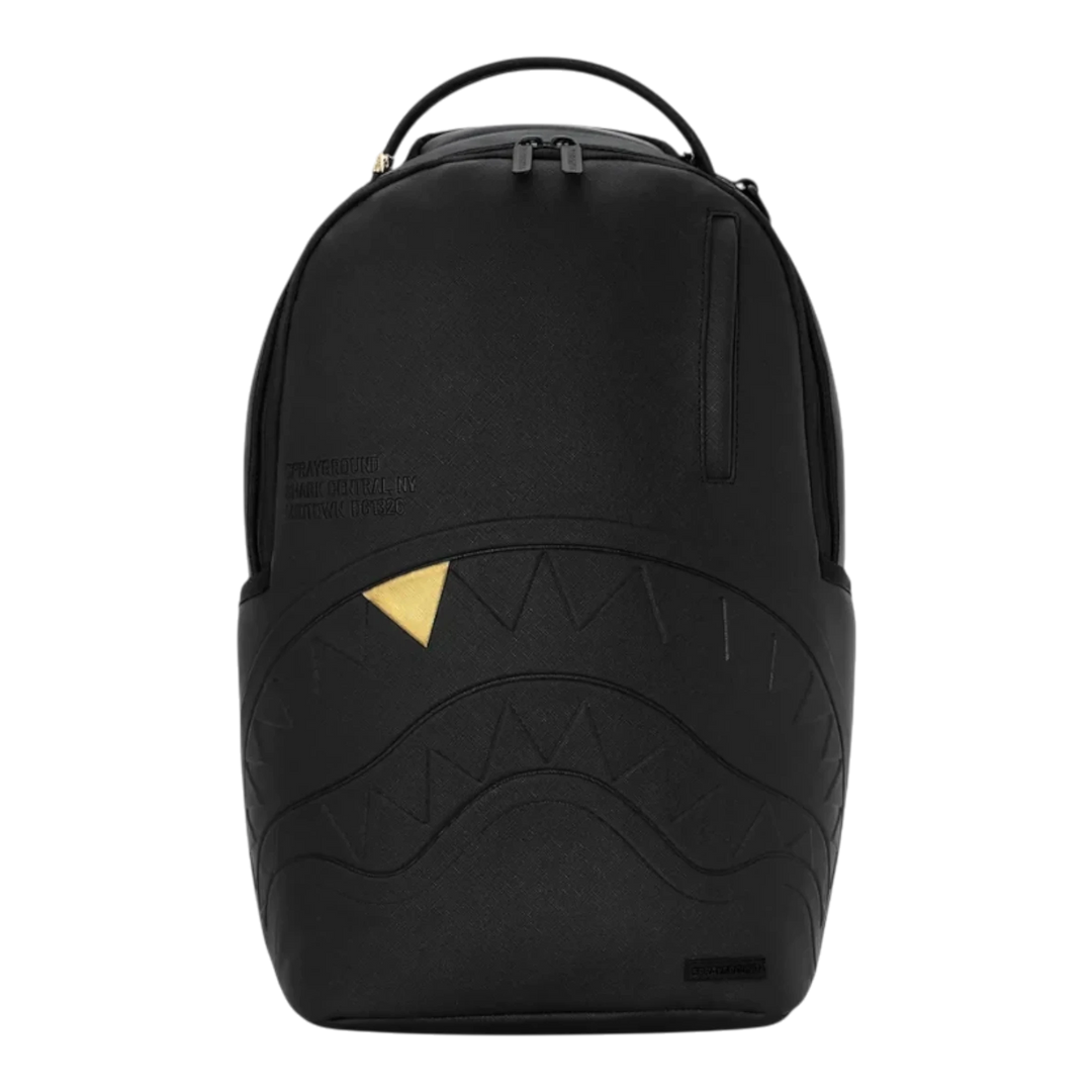 HypeSelection Sprayground black backpack with embossed shark mouth design and a single gold tooth detail.