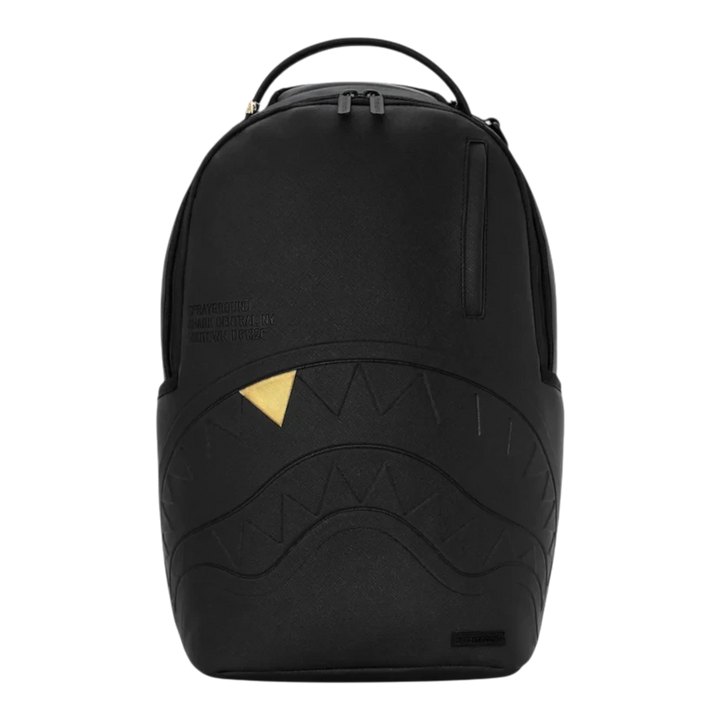 HypeSelection Sprayground black backpack with embossed shark mouth design and a single gold tooth detail.