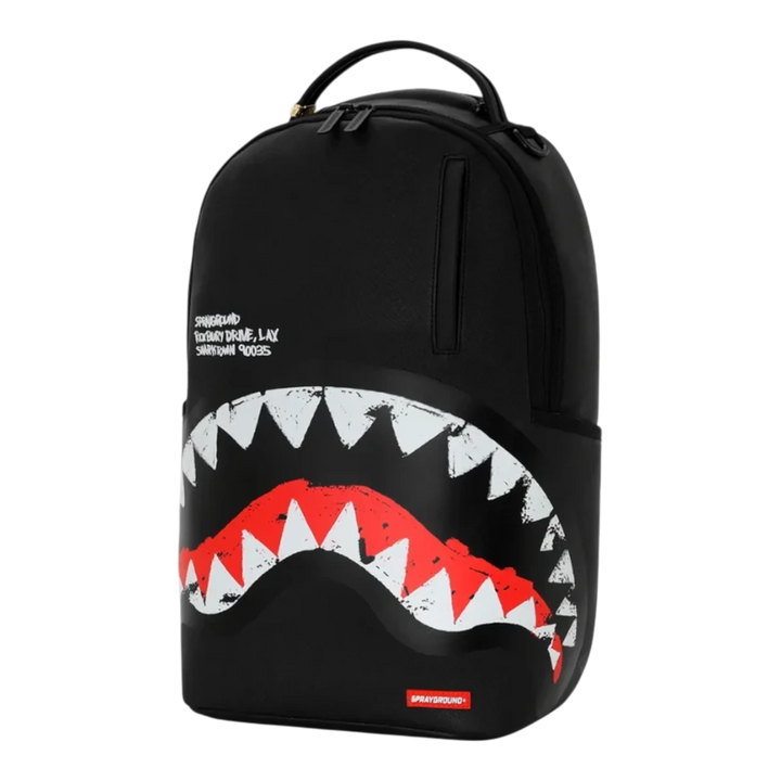 HypeSelection Sprayground black backpack featuring a bold white and red embroidered shark mouth graphic design