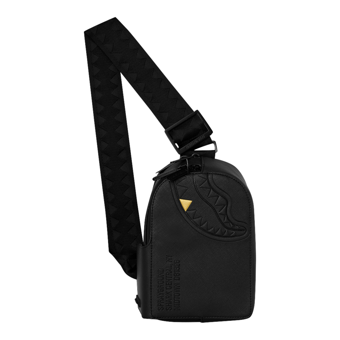 HypeSelection black faux leather Sprayground sling backpack with embossed shark mouth and gold fang detail