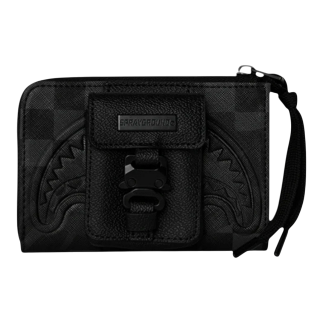 HypeSelection Sprayground black bi-fold wallet with shark teeth graphic and buckle closure. Durable synthetic material.