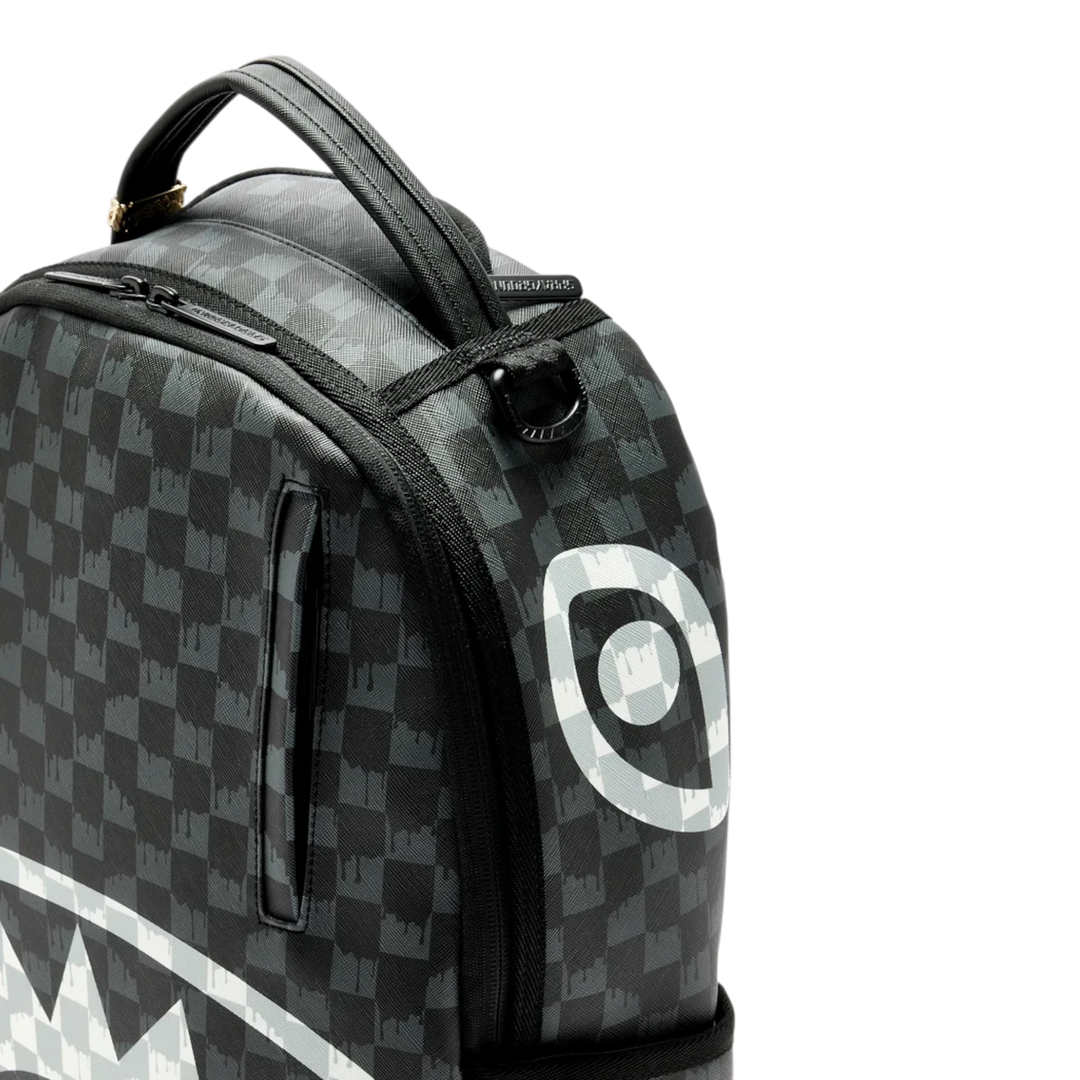 HypeSelection Sprayground black and white checkered drip backpack with signature shark mouth graphic detail