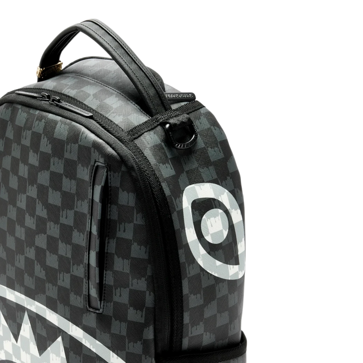 HypeSelection Sprayground black and white checkered drip backpack with signature shark mouth graphic detail