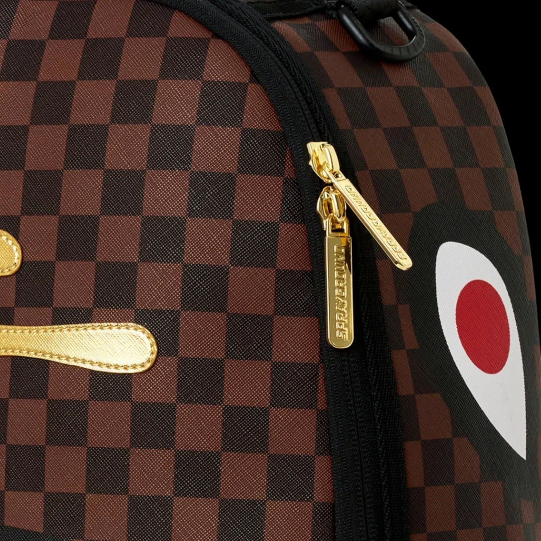 HypeSelection Sprayground Sharks In Paris backpack with brown checkered pattern, gold zipper pulls, and shark graphic.