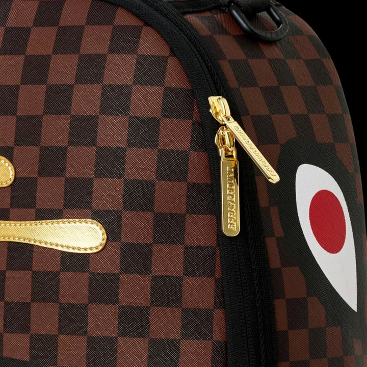 HypeSelection Sprayground Sharks In Paris backpack with brown checkered pattern, gold zipper pulls, and shark graphic.
