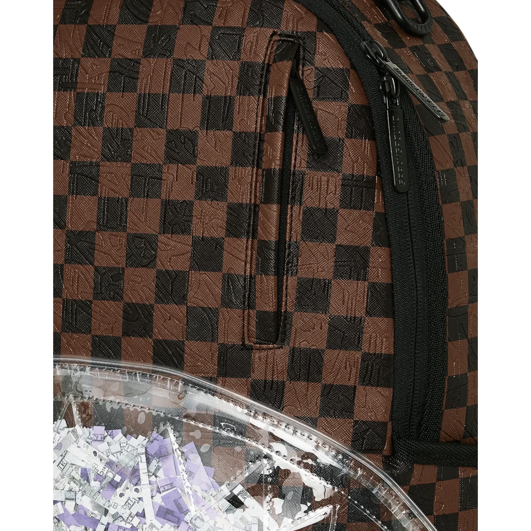 HypeSelection Sprayground Shredded Money DLXSV backpack featuring a brown and black checkered pattern and clear pocket.