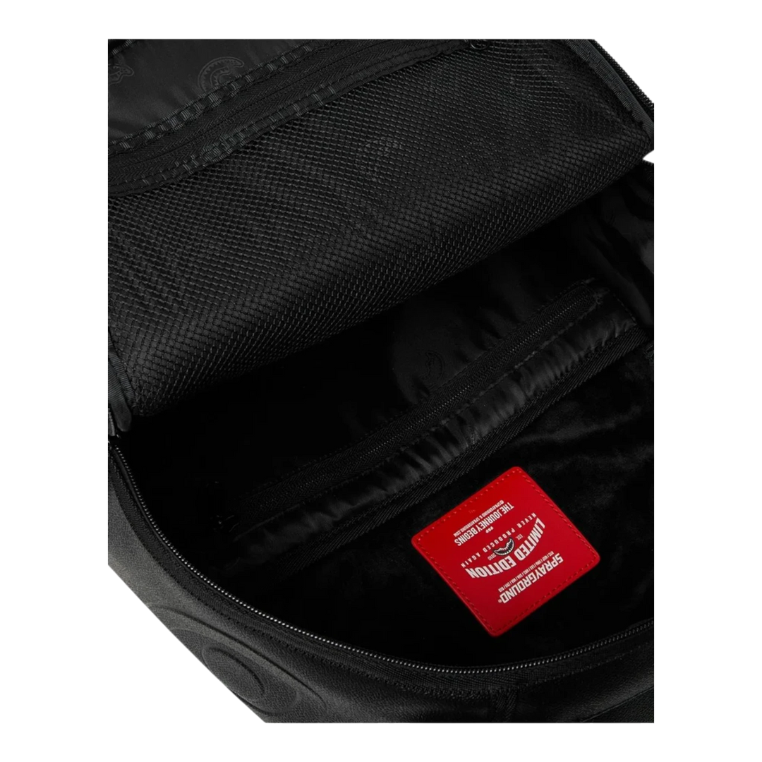 HypeSelection Sprayground Gold Brick Luxe black PVC backpack interior with mesh pockets and red limited edition tag.