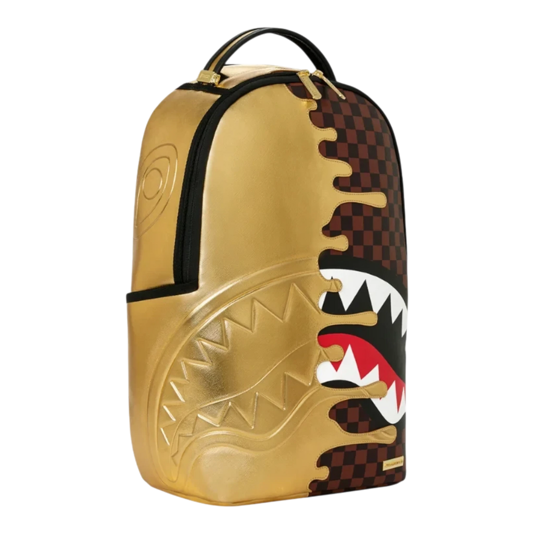 HypeSelection Sprayground Sharks In Paris gold drip backpack with signature shark mouth graphic and checkerboard print