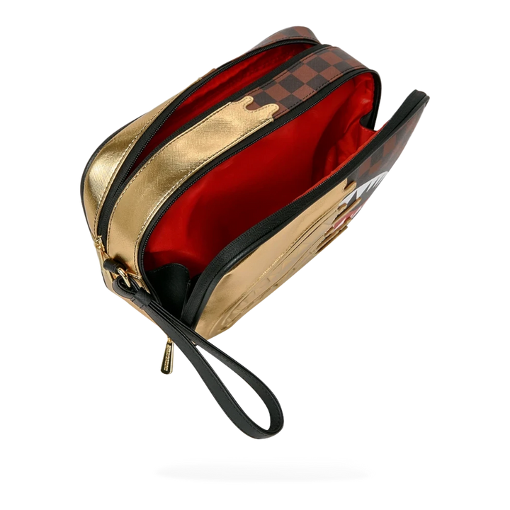 HypeSelection Sprayground Sharks In Paris gold toiletry bag with signature graphic print and red interior lining.