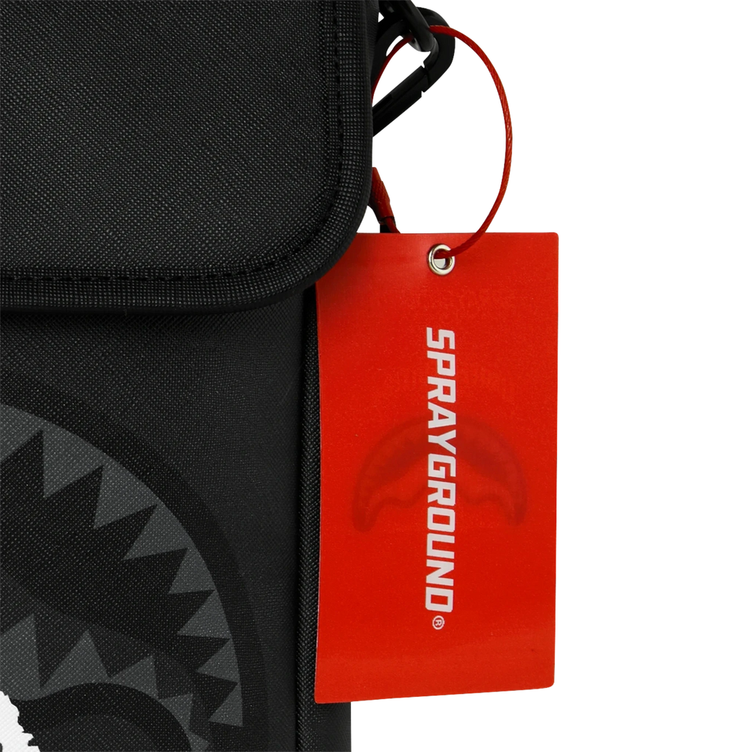 HypeSelection Sprayground Center Rip Reveal messenger sling featuring a black fabric bag and a red brand hangtag.