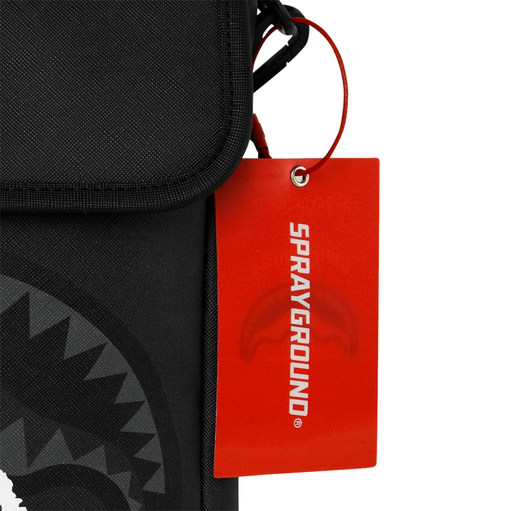 HypeSelection Sprayground Center Rip Reveal messenger sling featuring a black fabric bag and a red brand hangtag.