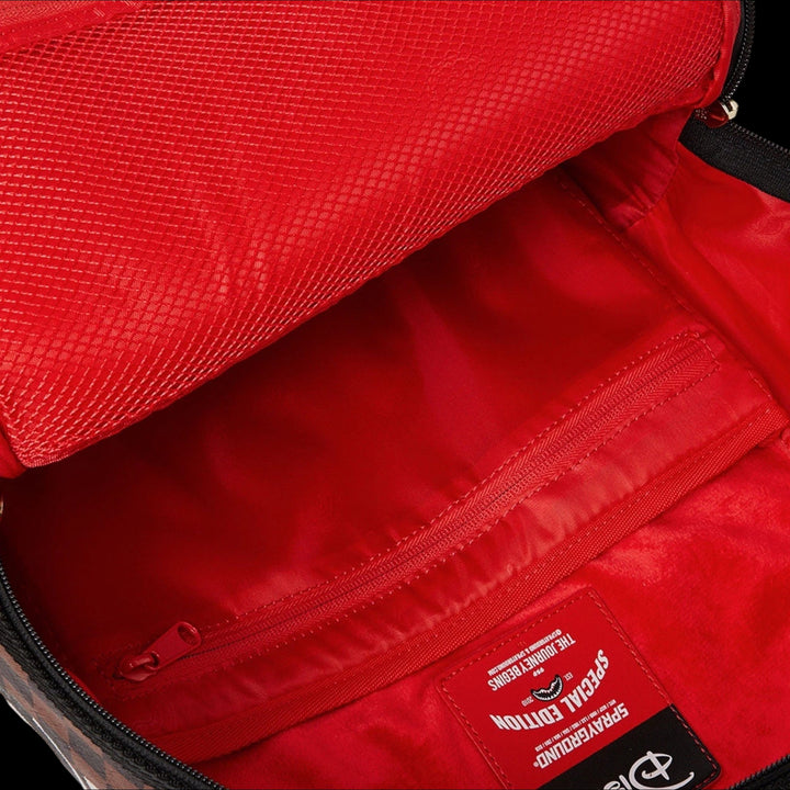 HypeSelection Sprayground Mickey Global Mogul backpack interior with red mesh pocket and special edition label