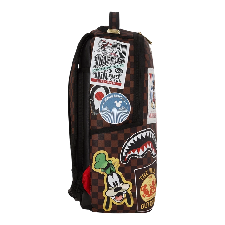 HypeSelection Sprayground Mickey Global Mogul backpack with brown checkered pattern and colorful character patches.