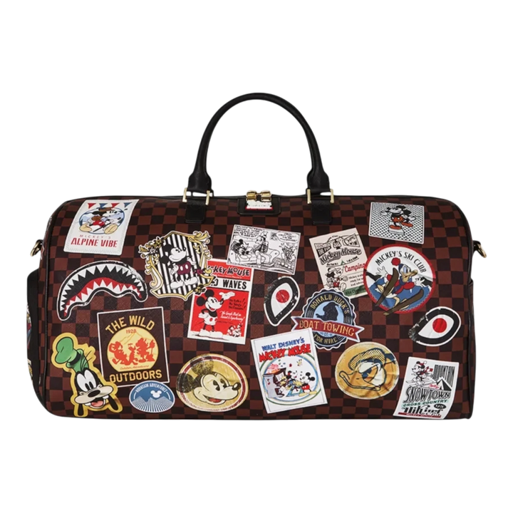 HypeSelection Sprayground Mickey Global Mogul duffle bag with brown checkered pattern and colorful Disney patches