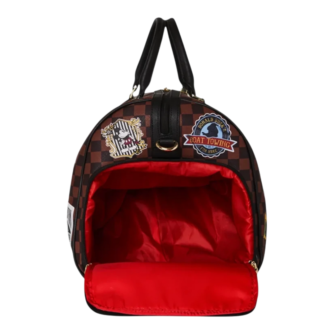 HypeSelection Sprayground Mickey Mouse duffle bag with brown checkered pattern, patches, and bright red interior lining.