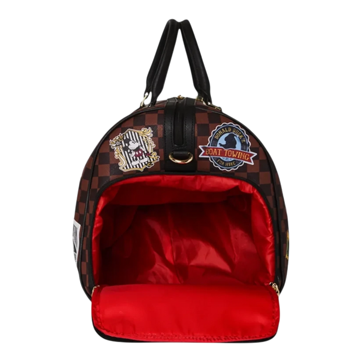 HypeSelection Sprayground Mickey Mouse duffle bag with brown checkered pattern, patches, and bright red interior lining.