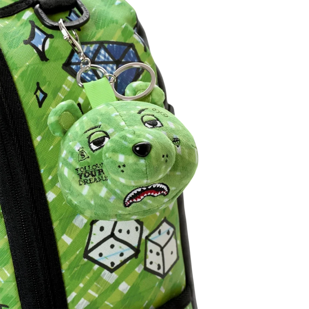 HypeSelection Sprayground Money Bear Doodle backpack featuring a green plush bear keychain with graphic print details.
