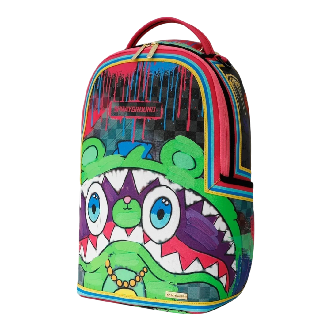 HypeSelection Sprayground New Gary DLXSV backpack featuring a vibrant graffiti-style character print and gold zippers.