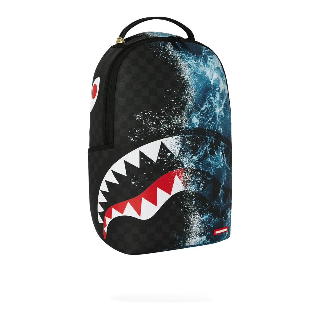 HypeSelection Sprayground Split Ocean Deep DLXSV backpack featuring a black checkerboard and ocean wave shark graphic.