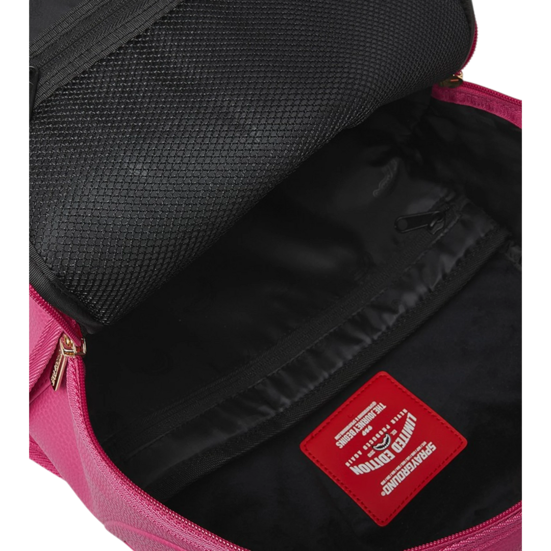 HypeSelection Sprayground Shark Pink Attack backpack interior with mesh pocket, laptop sleeve, and red limited edition tag.