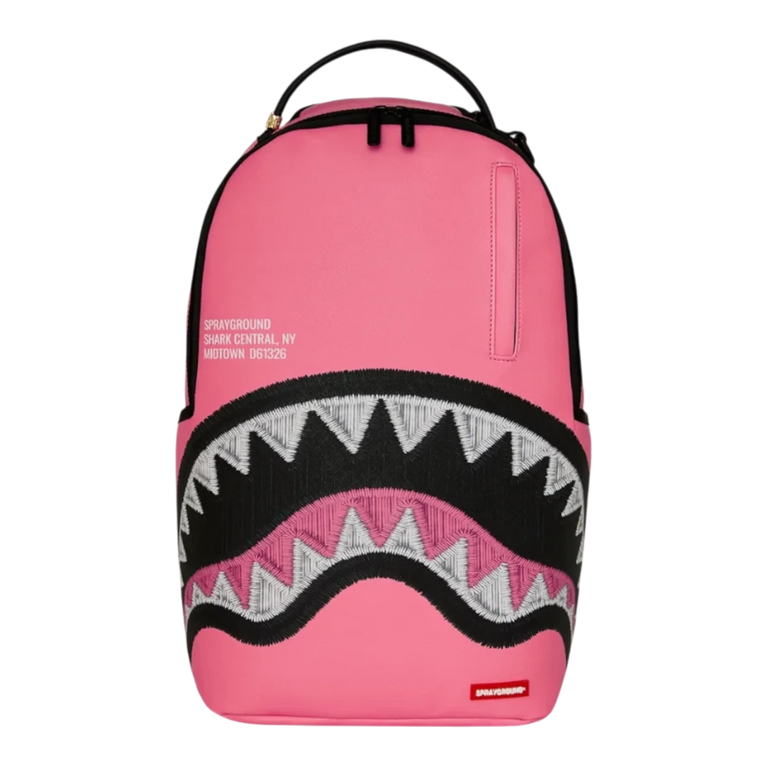 HypeSelection Sprayground pink backpack featuring an embroidered shark mouth graphic and signature branding