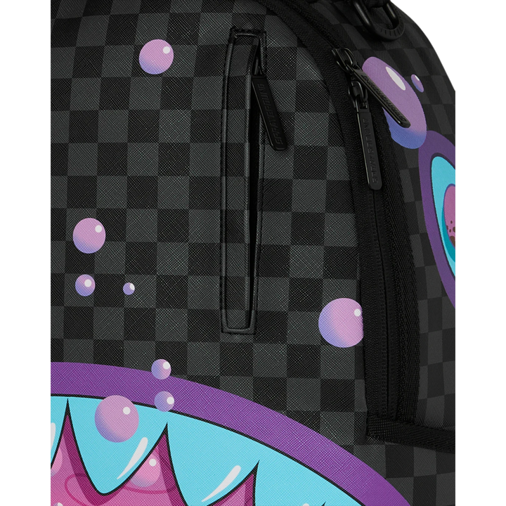 HypeSelection Sprayground purple slime takeover backpack with checkered pattern and shark mouth graphic.
