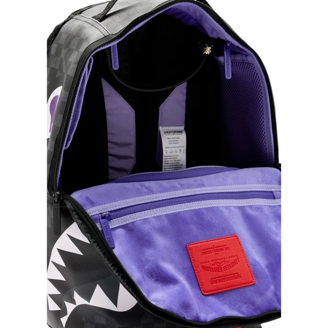 HypeSelection Sprayground reversible backpack with purple interior lining and signature shark mouth graphic design