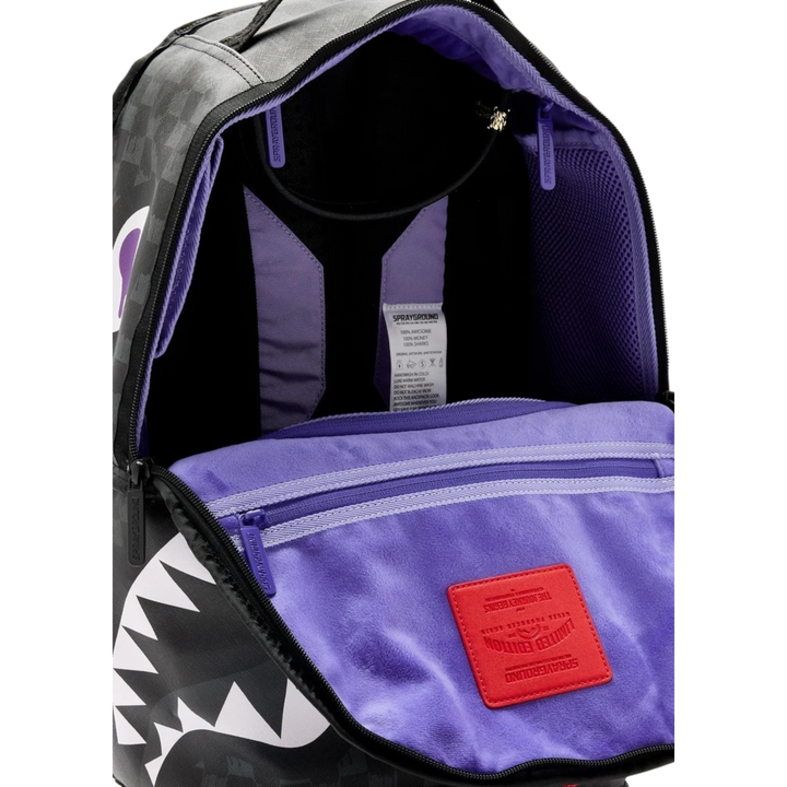 HypeSelection Sprayground reversible backpack with purple interior lining and signature shark mouth graphic design