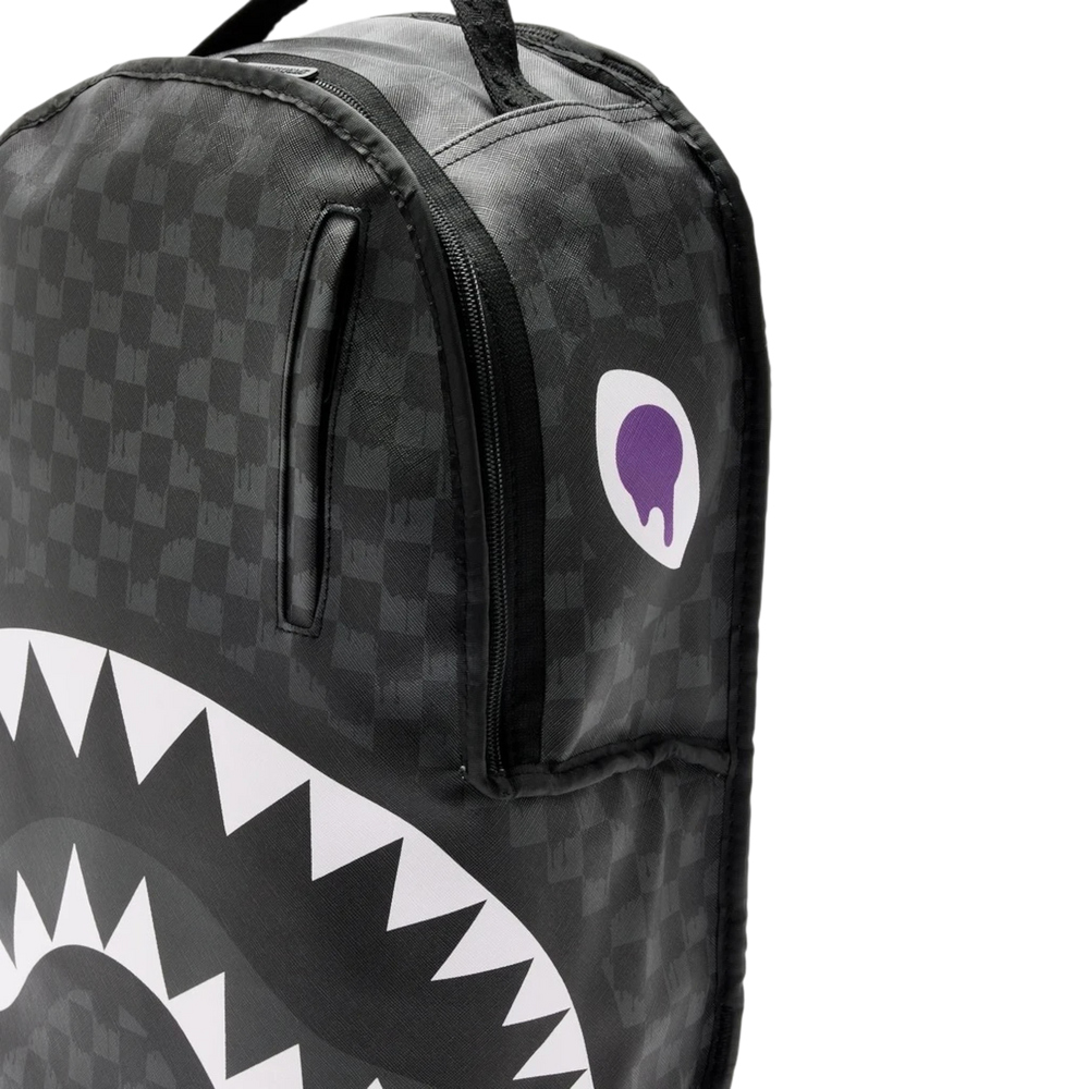 HypeSelection Sprayground Reversible V2 DLXSV backpack in black with iconic shark mouth graphic and purple logo patch