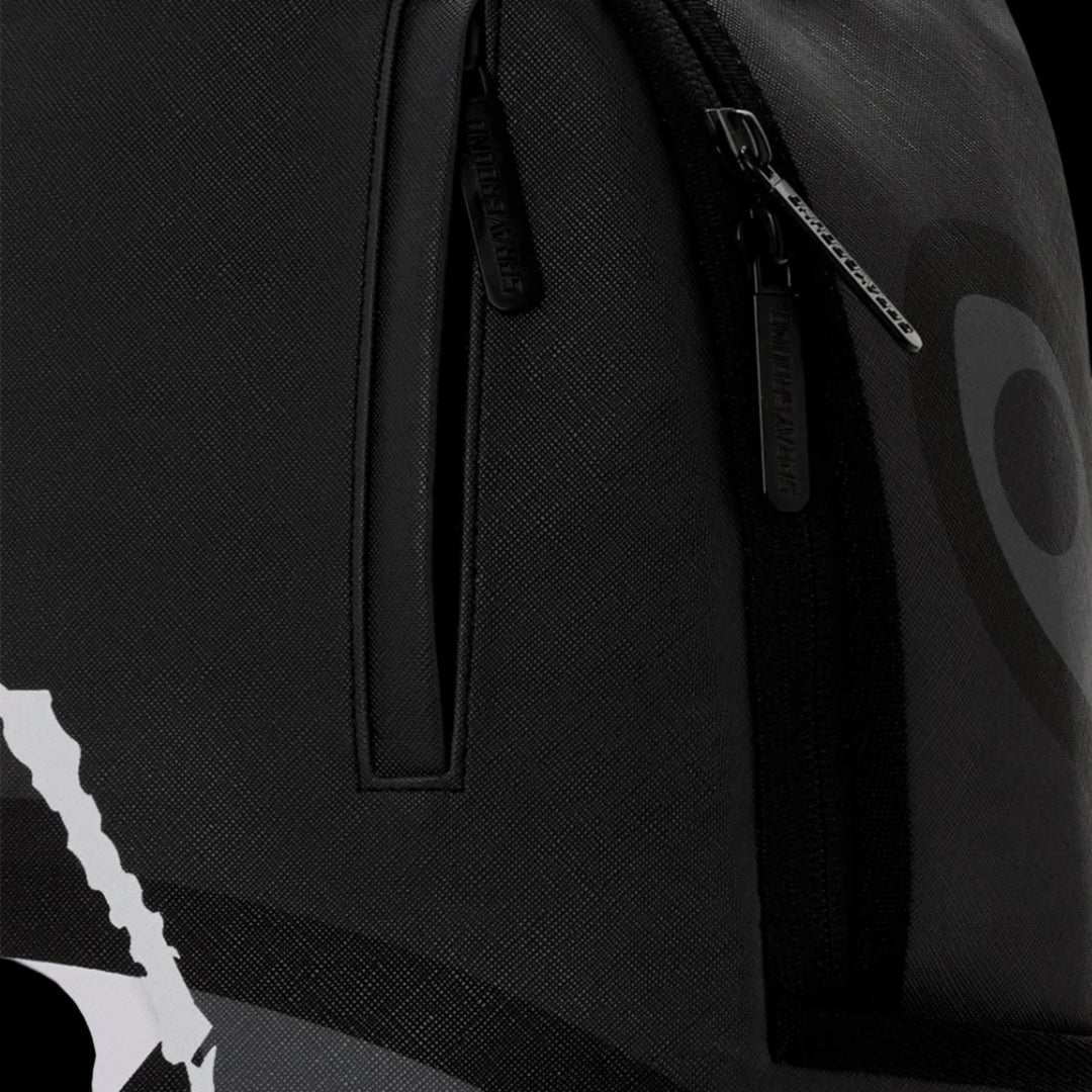 HypeSelection Sprayground Center Rip Reveal DLXSV backpack featuring black textured fabric and branded zipper pulls.