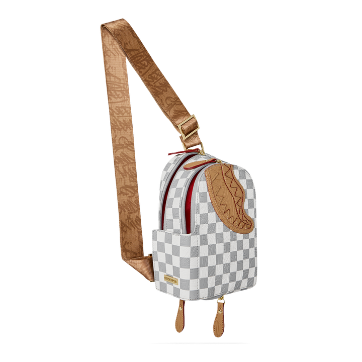 HypeSelection Sprayground Ritz Riviera faux leather sling bag with white and grey checkered pattern and shark mouth.