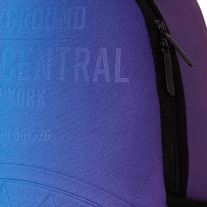 HypeSelection Sprayground Shark Central embossed nylon backpack in a blue and purple gradient dusk colourway