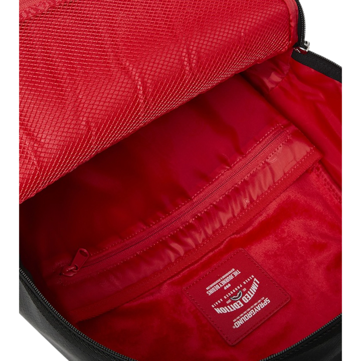HypeSelection Sprayground Shark Central Wave backpack interior with red lining, mesh pocket, and zippered compartment. Features a red &