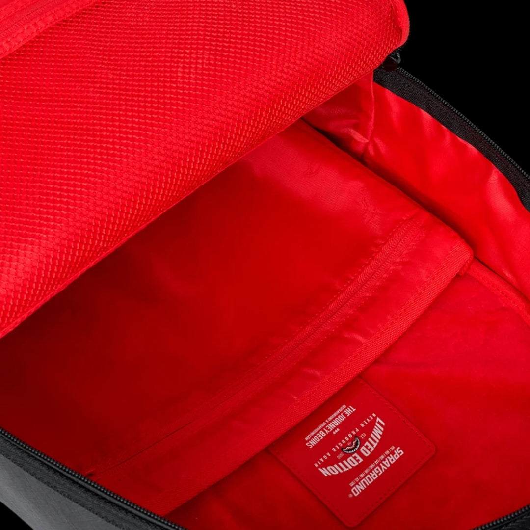 HypeSelection Sprayground Shark Central backpack interior with vibrant red lining and limited edition brand patch