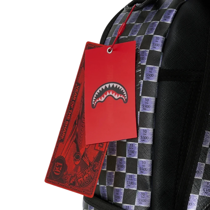 HypeSelection Sprayground Scratch Off Shark backpack with red branded hang tags and checkered graphic pattern