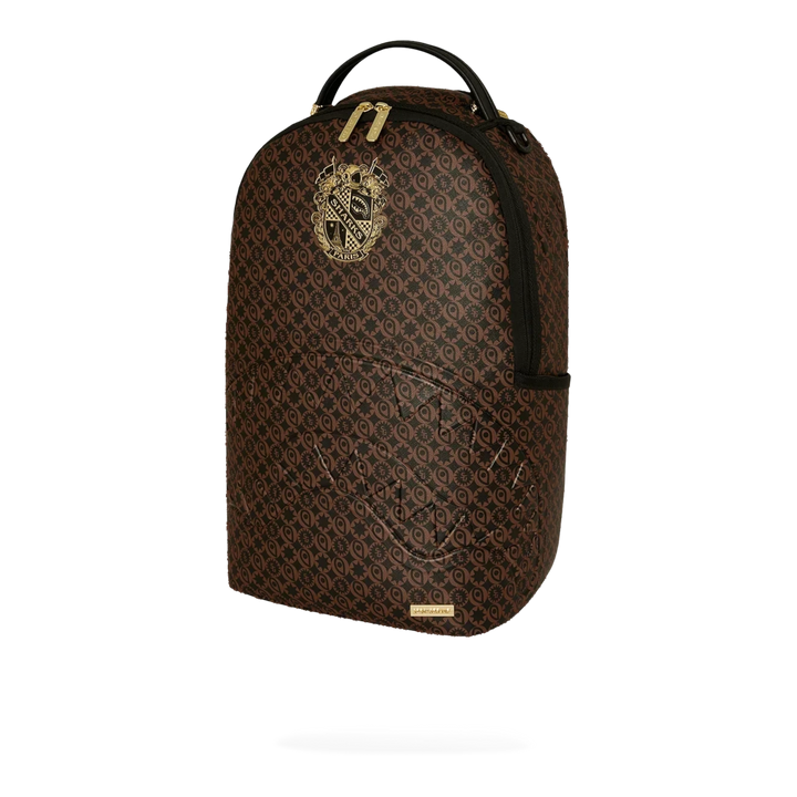 HypeSelection Sprayground Sharks South Of France DLXSV brown PVC backpack with gold emblem and monogram pattern