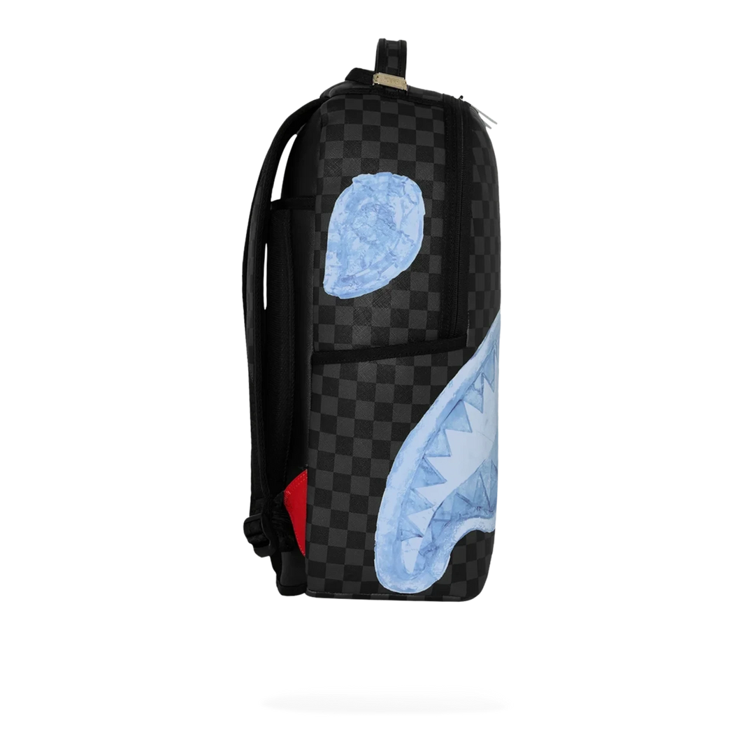 HypeSelection Sprayground Sharks On Iceberg DLXSV backpack featuring a black checkered pattern and blue shark graphic.