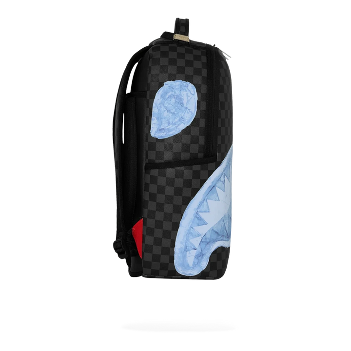 HypeSelection Sprayground Sharks On Iceberg DLXSV backpack featuring a black checkered pattern and blue shark graphic.