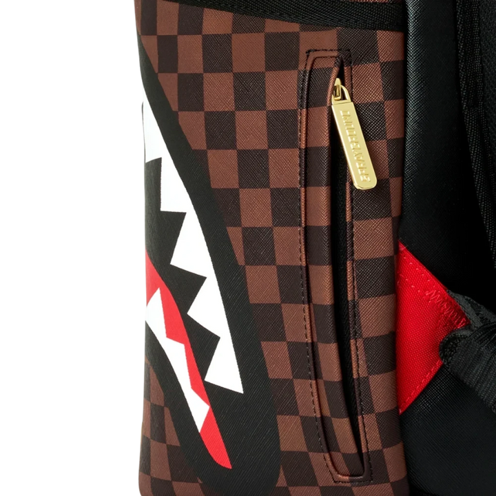 HypeSelection Sprayground Sharks In Paris backpack featuring brown checkerboard pattern and iconic shark mouth graphic