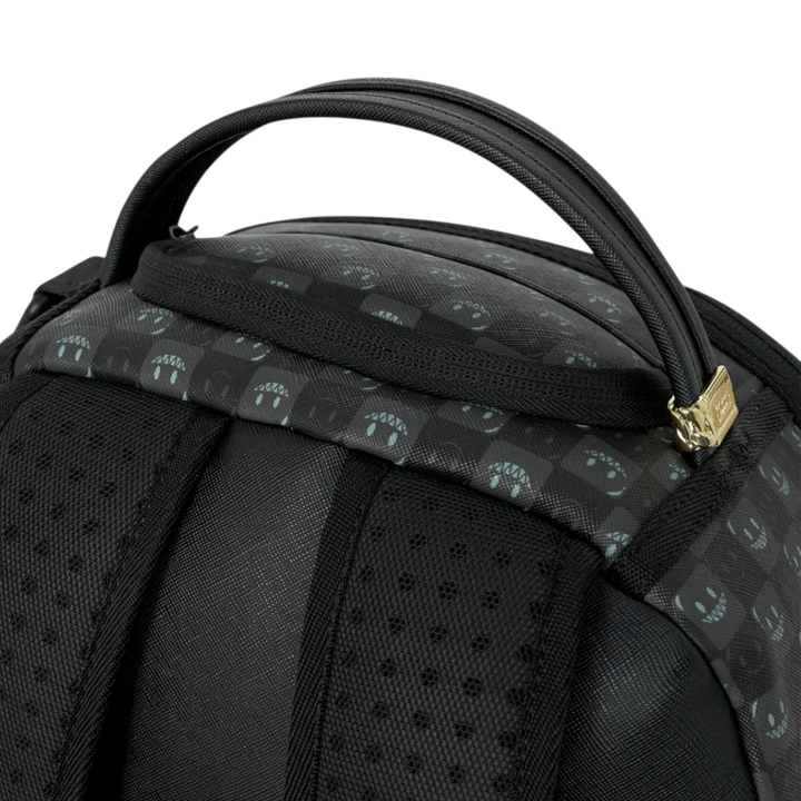HypeSelection Sprayground Sharks In Paris backpack featuring a black check pattern with graphic shark mouth details.