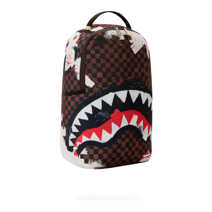 HypeSelection Sprayground Sharks In Paris backpack featuring a brown checkered pattern with a bold shark mouth graphic.