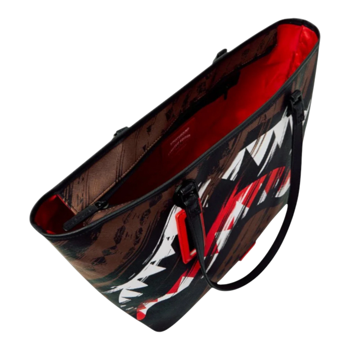 HypeSelection Sprayground Smeared Grunge Tote Bag with brown, black, white, and red abstract graphics and a red interior.