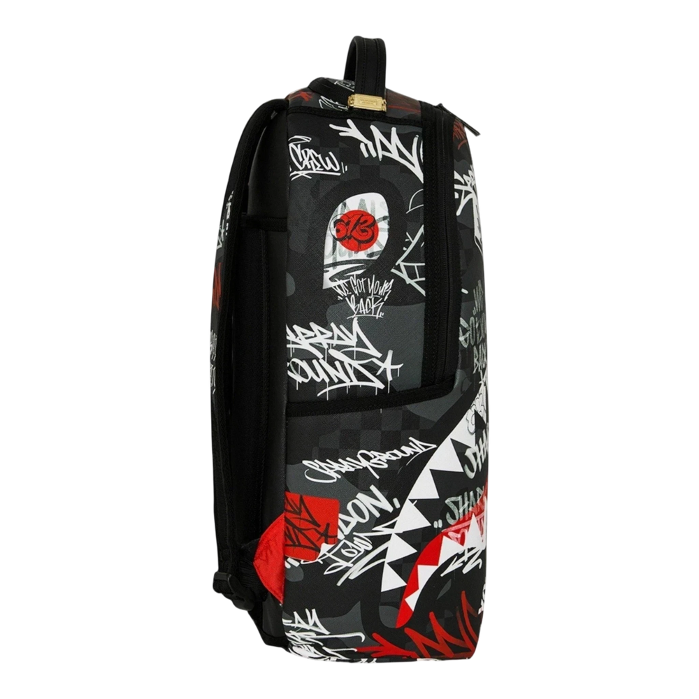 HypeSelection Sprayground Tagged Up DLXSV backpack featuring a black and grey graffiti print with red shark mouth