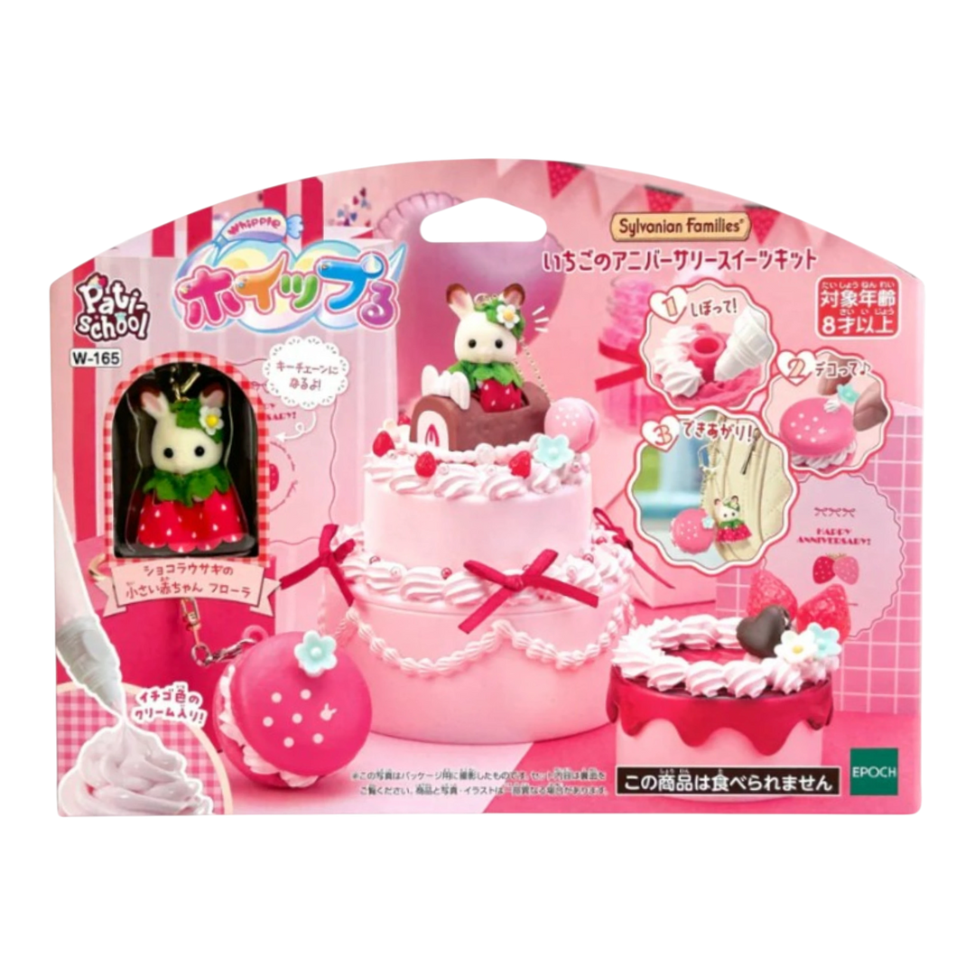HypeSelection Sylvanian Families Strawberry Anniversary Sweets Kit with miniature cake and bunny figure. Includes piping bag and decorations.