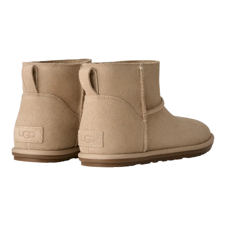 HypeSelection UGG Classic Mini Deconstructed boots in sand suede viewed from the back showing heel logo patches