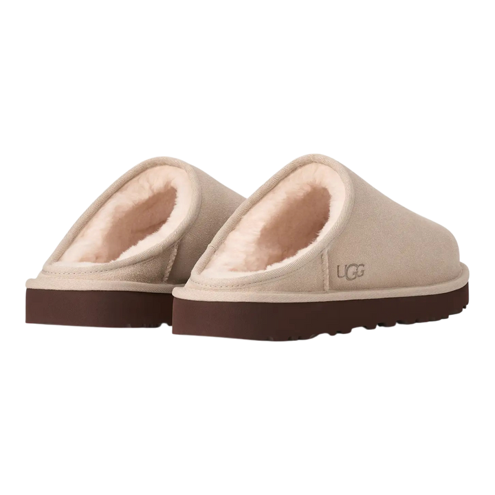 HypeSelection UGG Classic slip-on slippers in Moonlight beige suede with plush sheepskin lining and brown outsole.